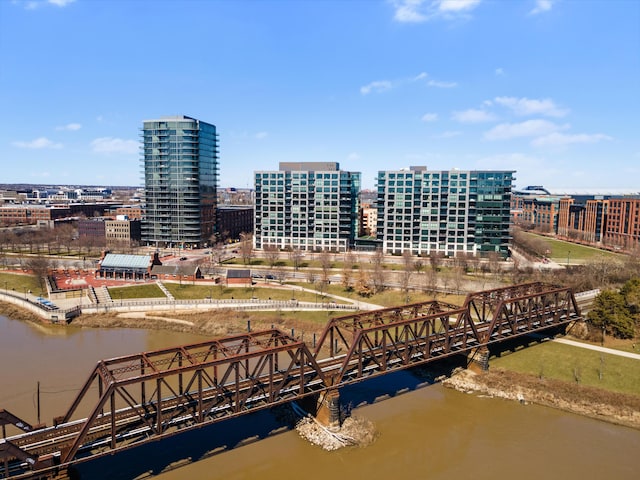 drone / aerial view featuring a water view and a city view