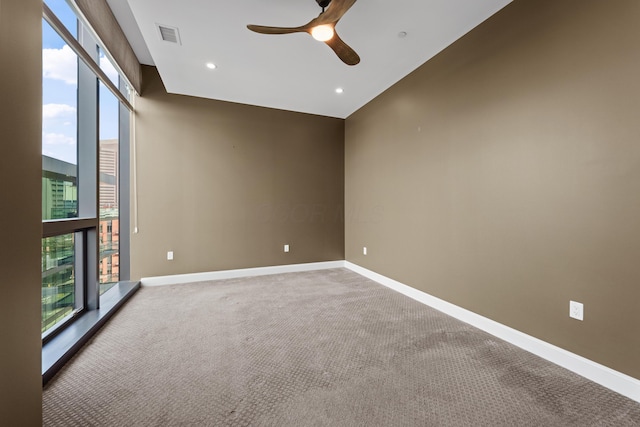 unfurnished room with carpet floors, ceiling fan, baseboards, and recessed lighting