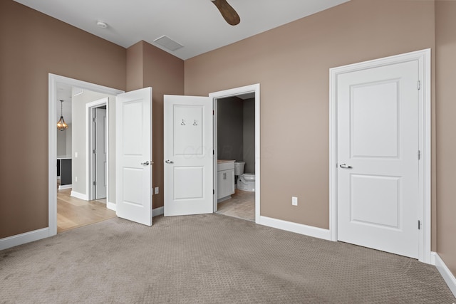 unfurnished bedroom featuring baseboards and light colored carpet