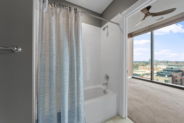 full bathroom with shower / bath combo, visible vents, and ceiling fan