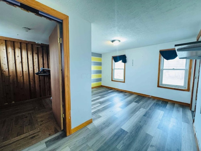 interior space with hardwood / wood-style floors and a textured ceiling