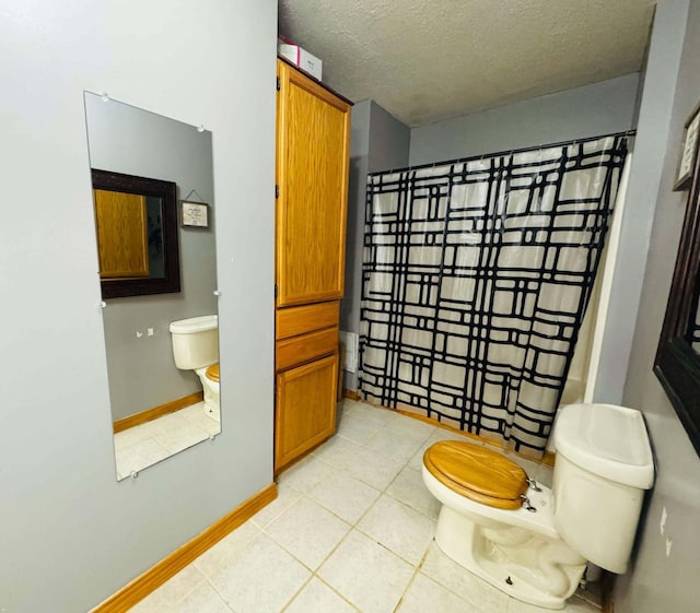 bathroom featuring toilet and a textured ceiling