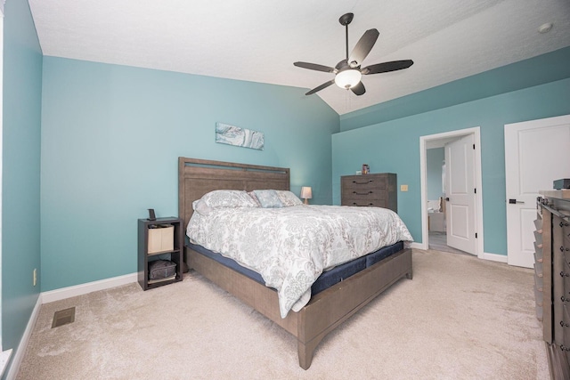 bedroom featuring light colored carpet, vaulted ceiling, and ceiling fan