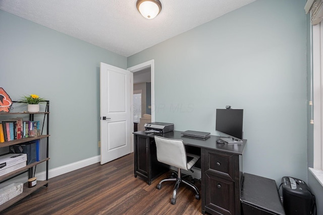 home office featuring dark hardwood / wood-style flooring and a textured ceiling