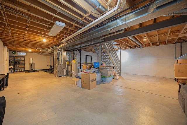 basement featuring heating unit and water heater