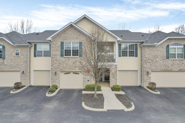 townhome / multi-family property featuring a garage