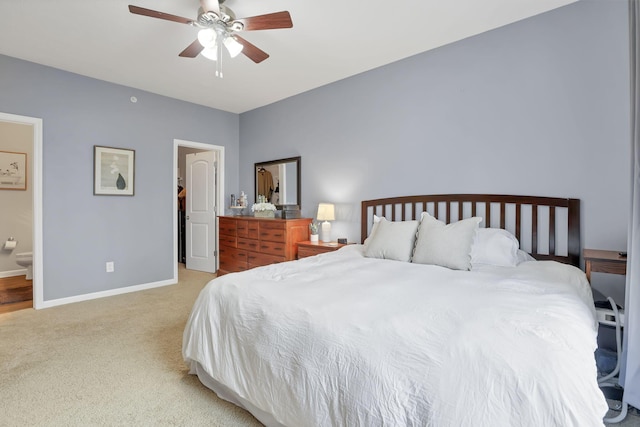 carpeted bedroom featuring ensuite bath and ceiling fan