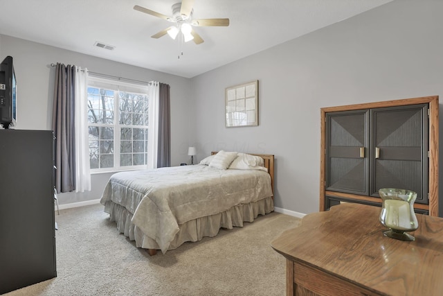 bedroom featuring ceiling fan and light carpet