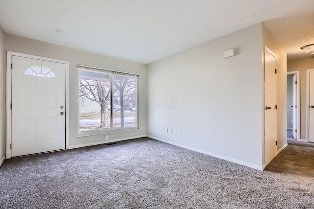 view of carpeted entrance foyer