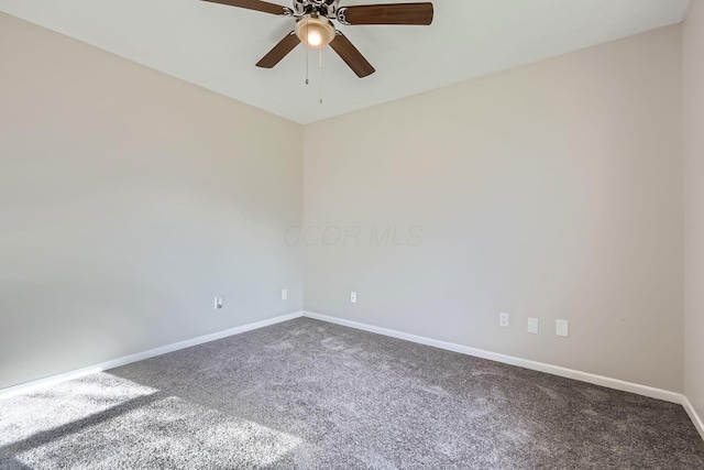 carpeted spare room with ceiling fan