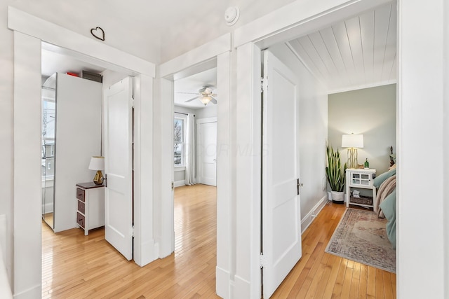 hallway with light wood-type flooring