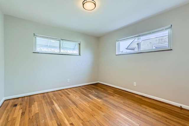 unfurnished room featuring light hardwood / wood-style flooring