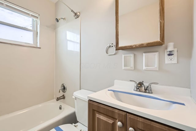 full bathroom featuring toilet,  shower combination, and vanity