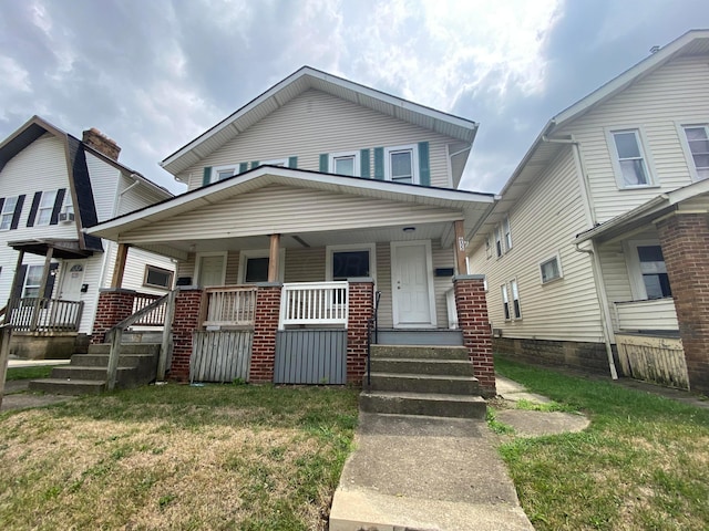 655-657 Frebis Ave, Columbus, OH 43206 - view of front of property featuring a porch and a front yard