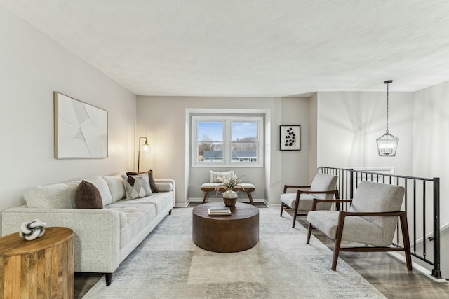 living room featuring hardwood / wood-style floors and a chandelier