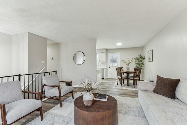 living room with light hardwood / wood-style flooring