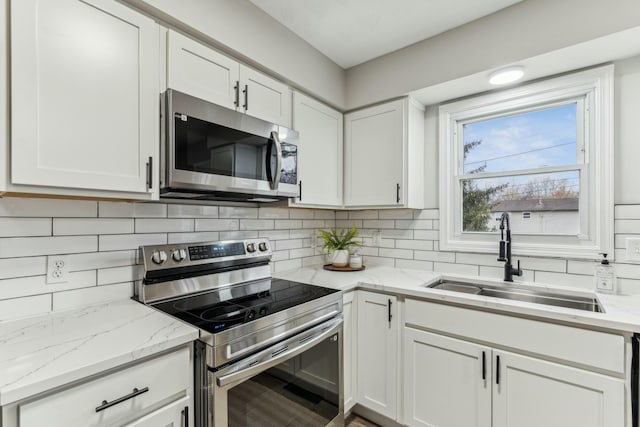 kitchen featuring sink, white cabinets, and stainless steel appliances