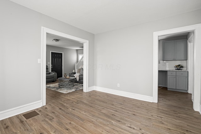 empty room with wood-type flooring