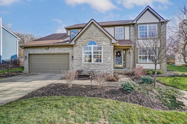 view of front of home with a garage and a front lawn