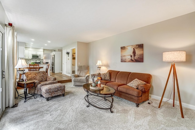 living room featuring light colored carpet