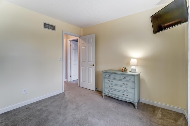 unfurnished bedroom featuring light colored carpet