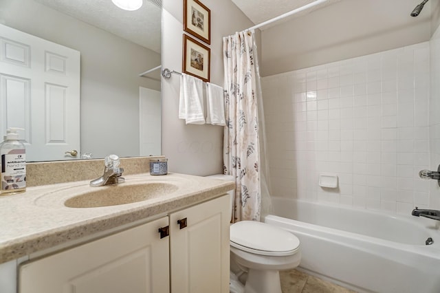 full bathroom featuring vanity, tile patterned floors, toilet, a textured ceiling, and shower / tub combo