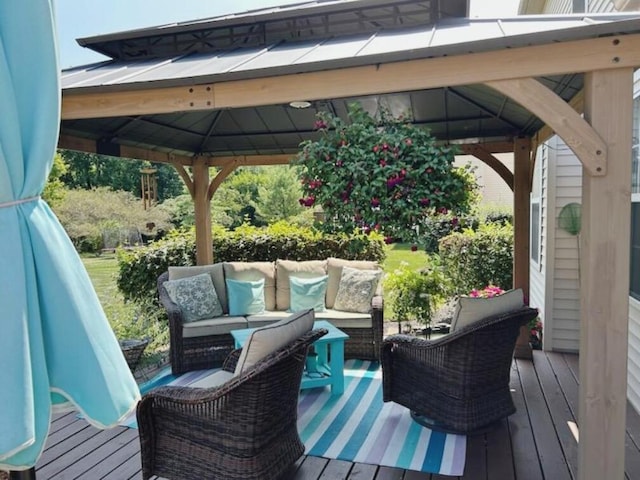 wooden deck with a gazebo and an outdoor hangout area