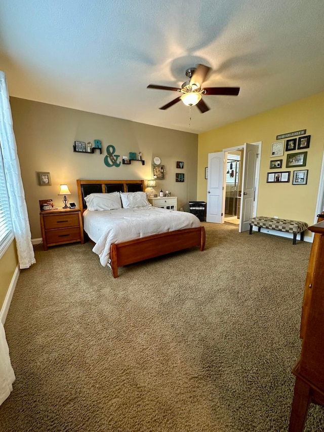 carpeted bedroom featuring a textured ceiling and ceiling fan