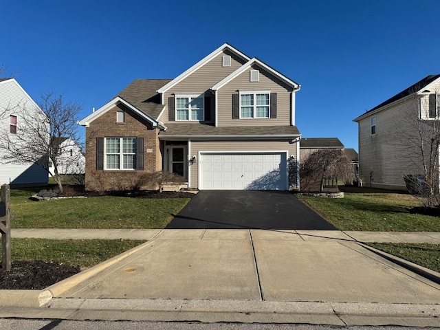 view of front property with a front yard and a garage