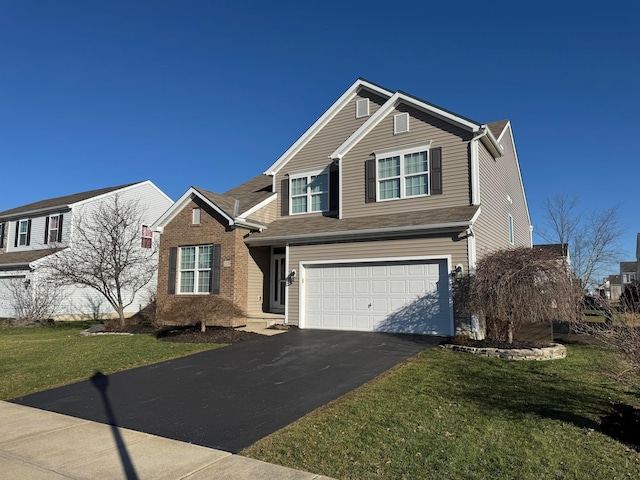 view of front facade featuring a front yard and a garage