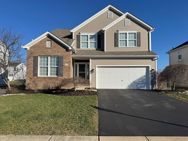 view of front property with a front yard and a garage