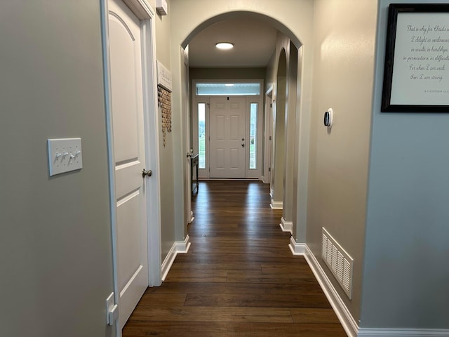 hall with dark hardwood / wood-style floors