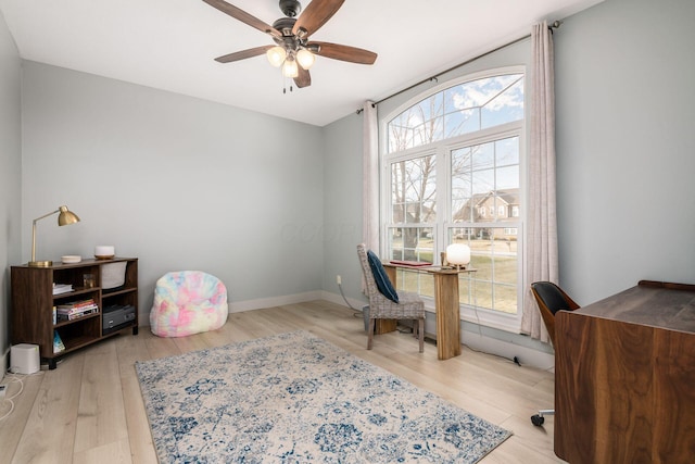 office with ceiling fan, light hardwood / wood-style flooring, and a wealth of natural light