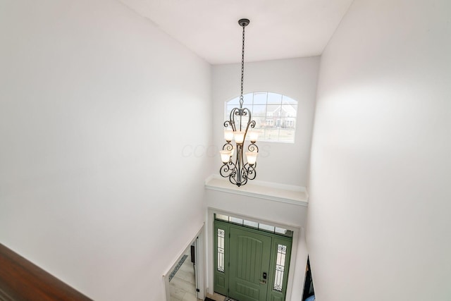 entryway featuring a notable chandelier