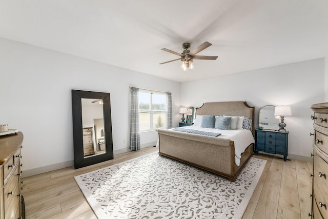 bedroom with ceiling fan and light hardwood / wood-style floors