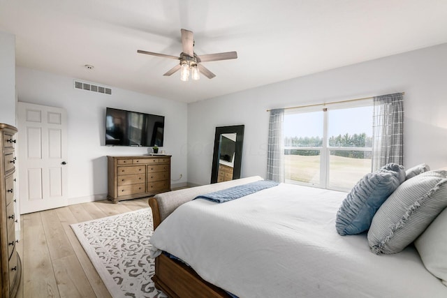 bedroom with light hardwood / wood-style floors and ceiling fan