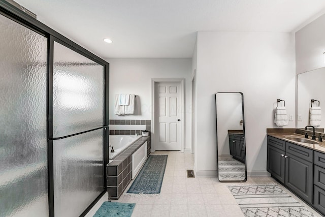 bathroom featuring plus walk in shower and vanity