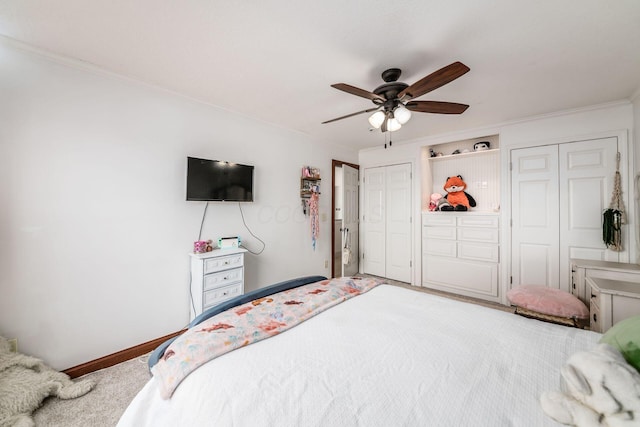 bedroom with ornamental molding, carpet, and ceiling fan