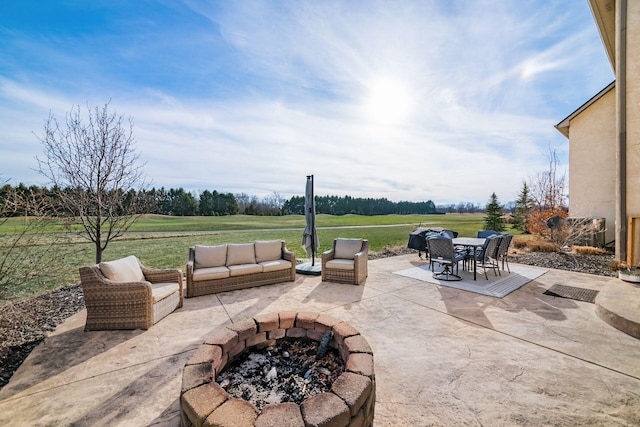 view of patio featuring a fire pit and a rural view