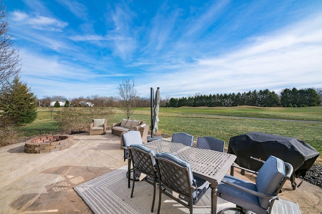 view of patio featuring an outdoor fire pit