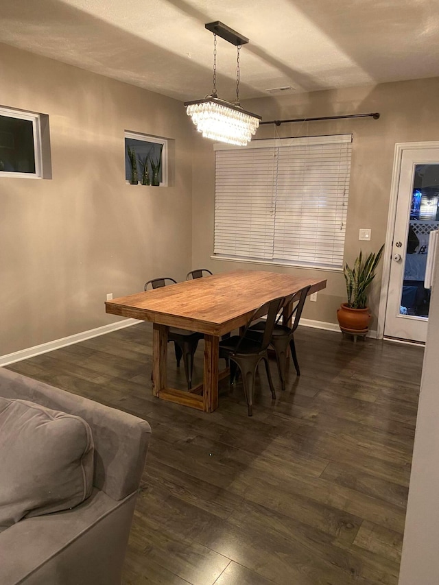 dining area featuring dark hardwood / wood-style flooring