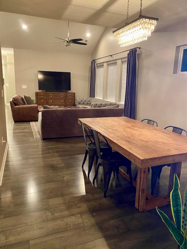 dining space featuring ceiling fan, lofted ceiling, and dark hardwood / wood-style flooring