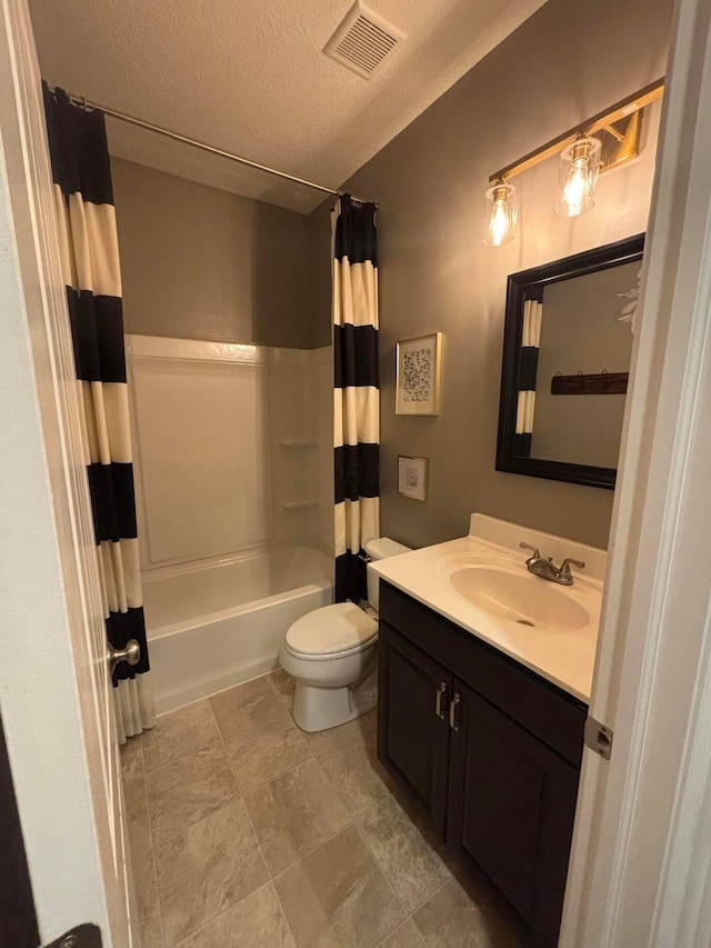 full bathroom with vanity, toilet, a textured ceiling, and shower / bath combo