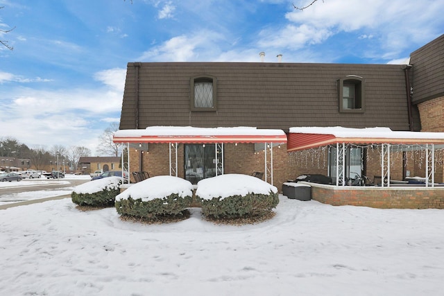 view of snow covered house