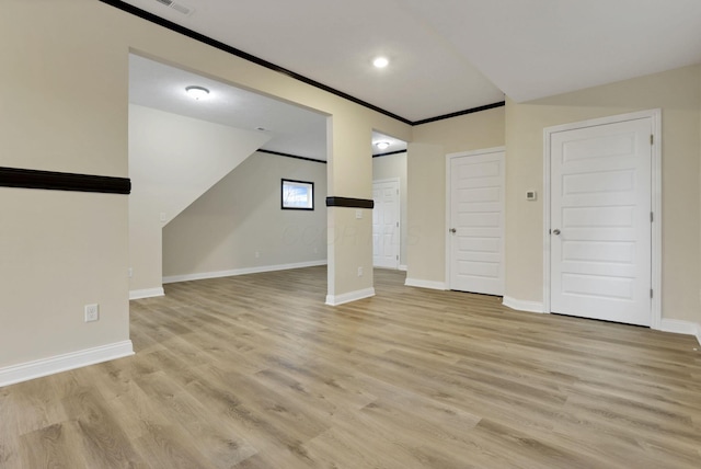 interior space with light hardwood / wood-style floors and crown molding