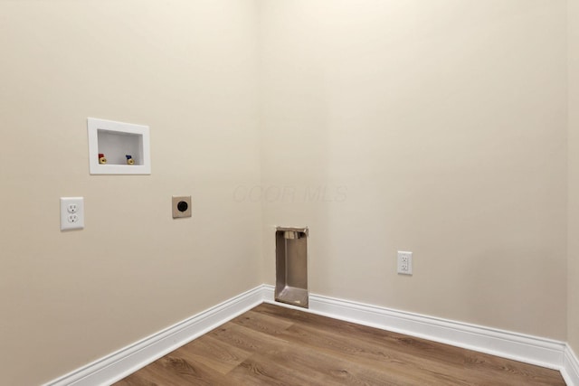 clothes washing area with hookup for a washing machine, hardwood / wood-style flooring, and electric dryer hookup