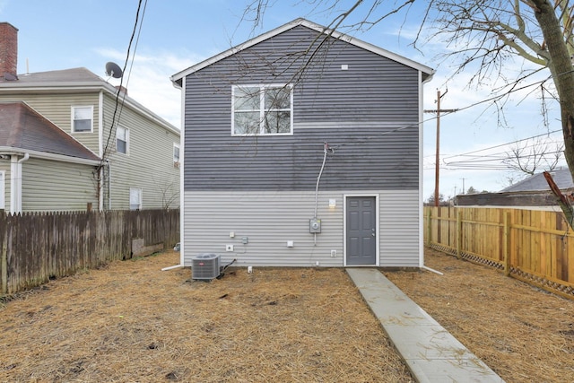 back of property with central AC unit