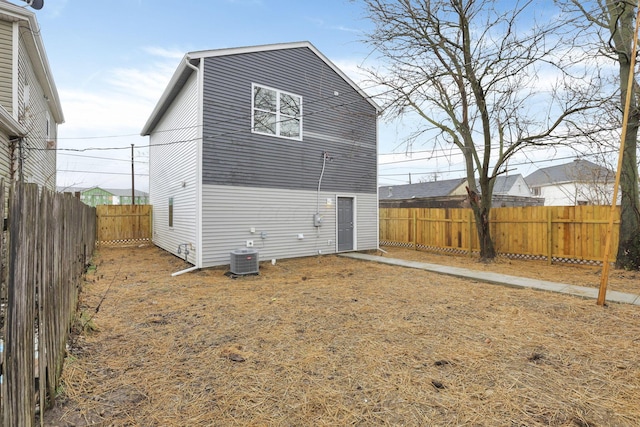 rear view of property featuring central air condition unit