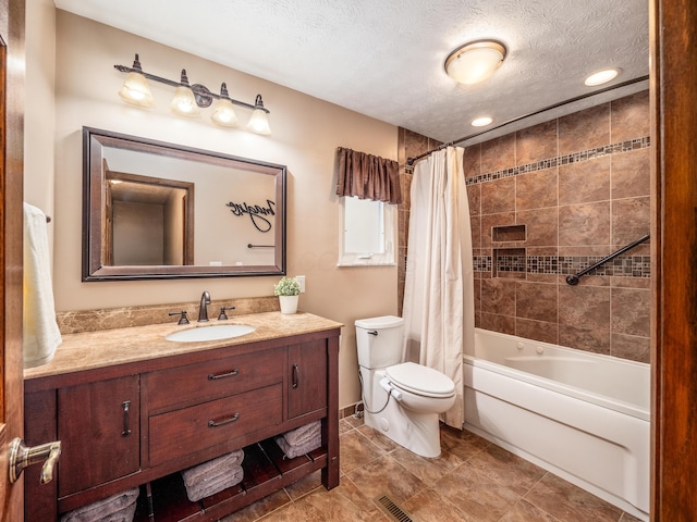 full bathroom with vanity, toilet, a textured ceiling, and shower / tub combo with curtain