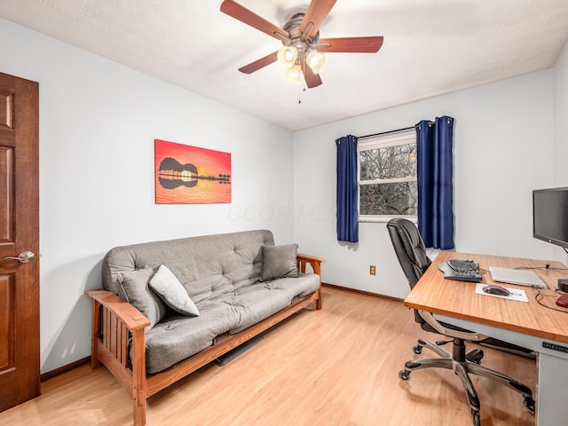 office area featuring ceiling fan and light hardwood / wood-style floors